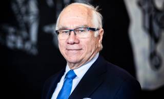 Chair of the Board of the University Jorma Eloranta looks at the camera smiling. 