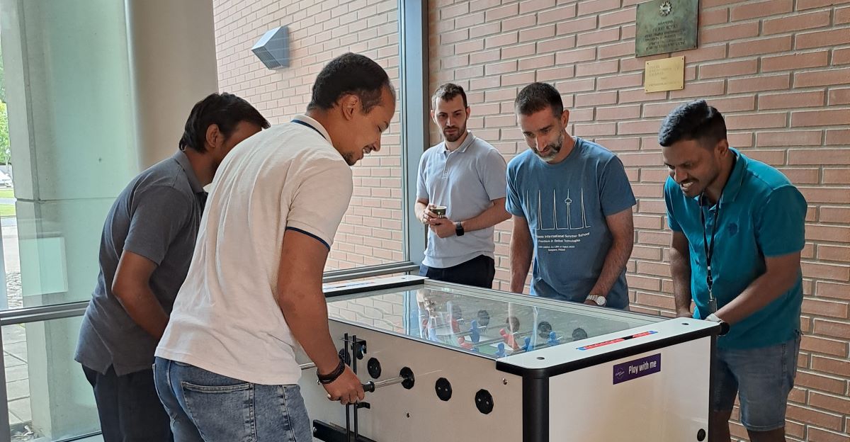 People playing table soccer
