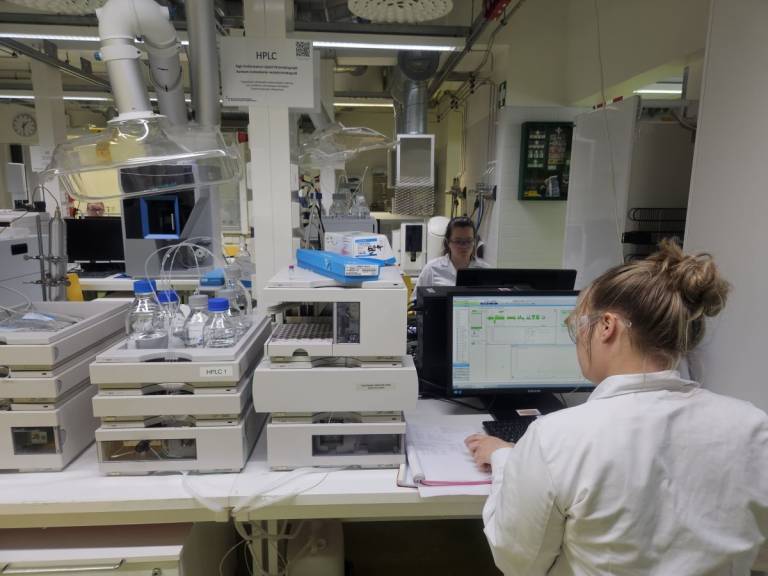 Students working with HPLC instruments.