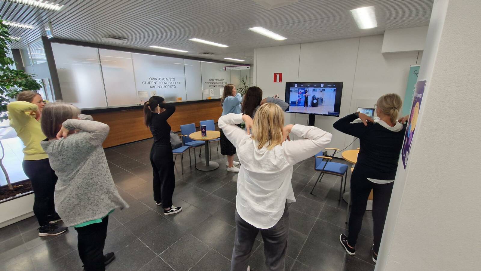 The employees are doing a workout during their break